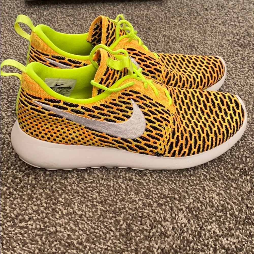 Neon yellow/ orange Nike tennis shoes